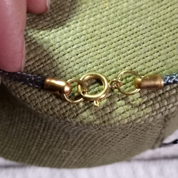 Goldtone gray black round donut pendant on gray cord necklace - Picture 3 of 3